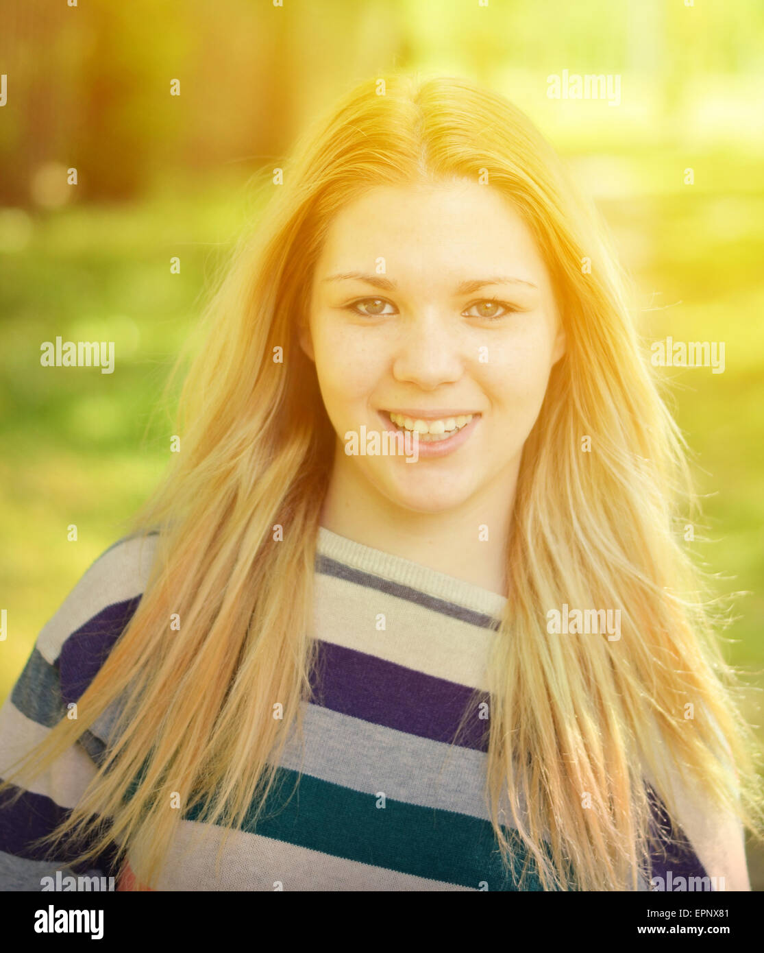Portrait of smiling girl outdoors Stock Photo - Alamy