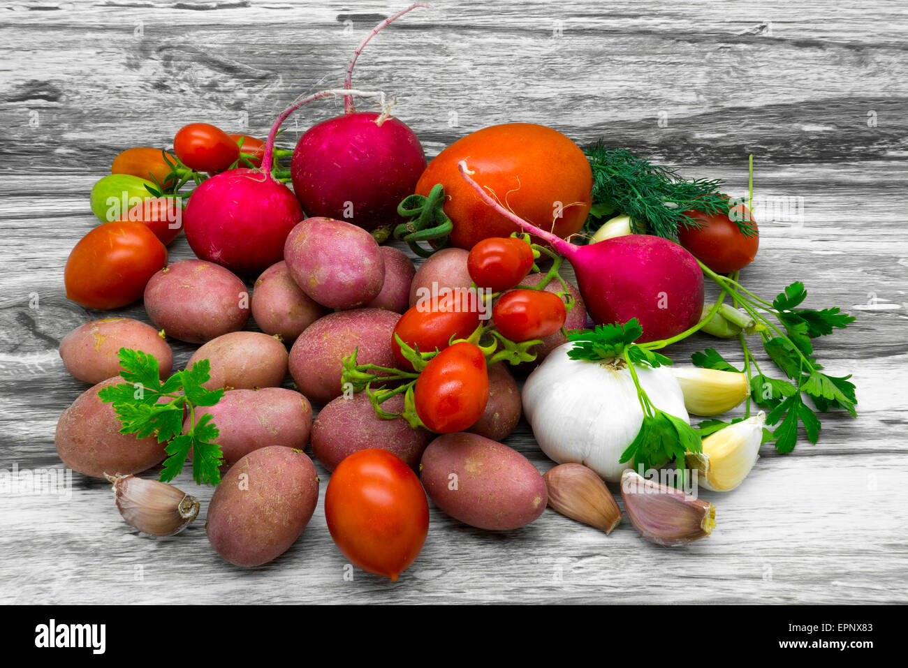 Vegetable rustic still life on a gray wooden background Stock Photo - Alamy