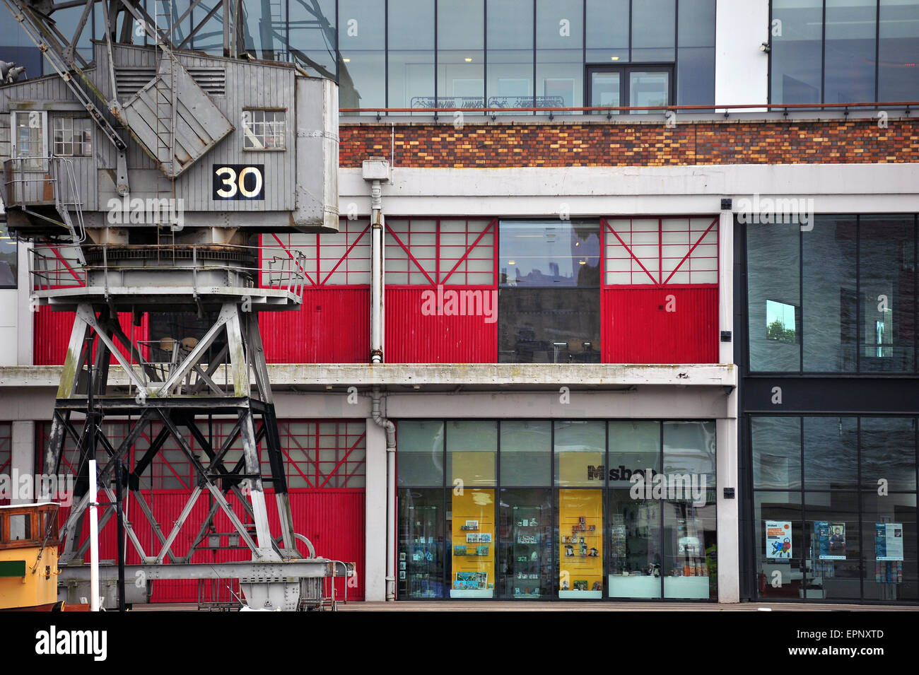 A preserved electric cargo crane outside the M Shed museum in Bristol