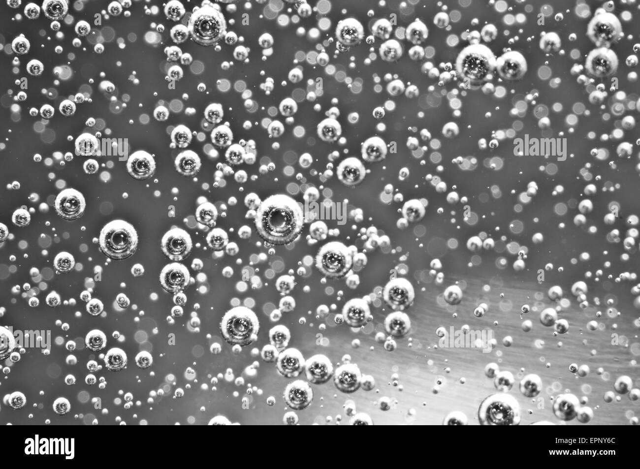 Air bubbles in water. Abstract black-and-white background. Macro photo, for your successful business design. Stock Photo