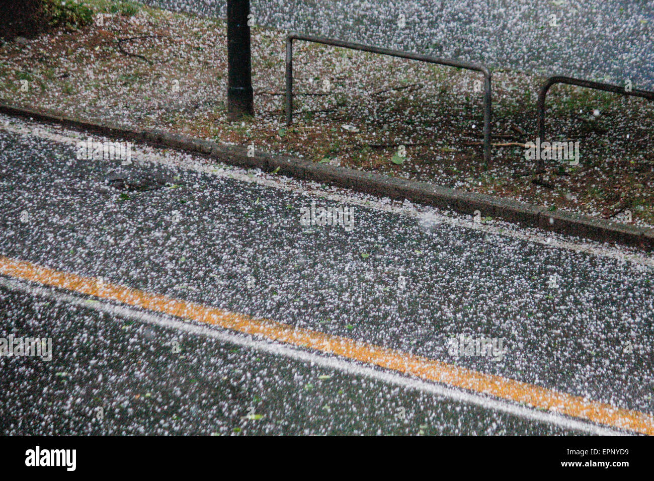 Turin, Italy. 20th May, 2015. A sudden hailstorm hit the city of Turin, making the road surface white as if there was snow. © Elena Aquila/Pacific Press/Alamy Live News Stock Photo