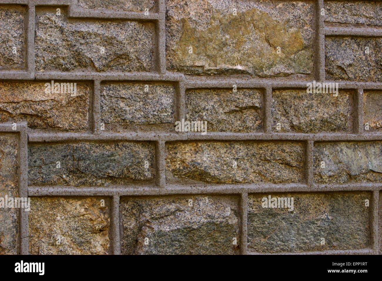 Close up view of a solid stone brick wall Stock Photo - Alamy