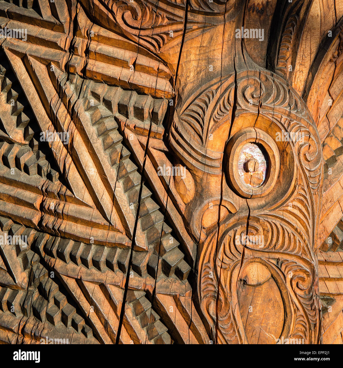 Detail on carving on a traditional wooden Maori mask at Te Puia near Rotorua in New Zealand North Island Stock Photo