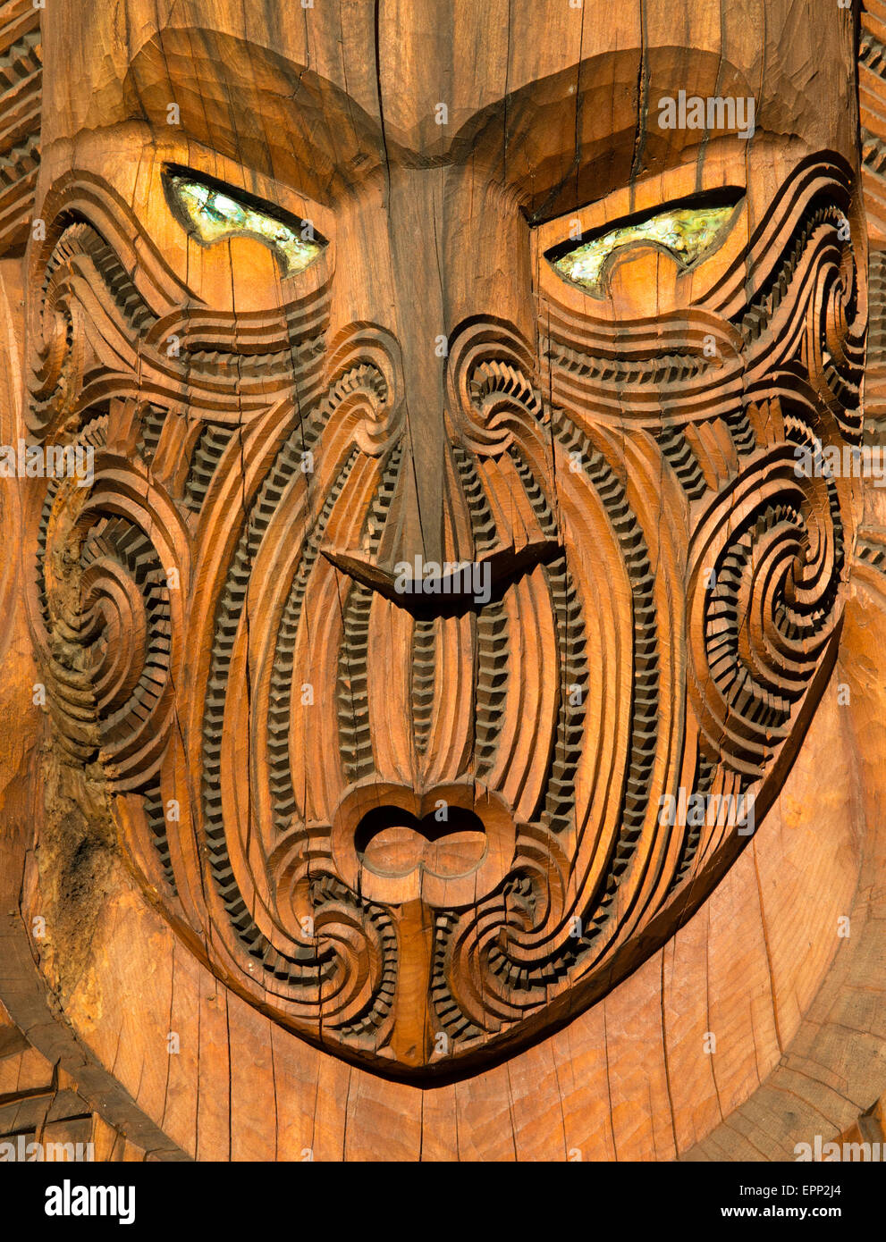 Carved wooden Maori masks at Te Puia near Rotorua in New Zealand North Island Stock Photo