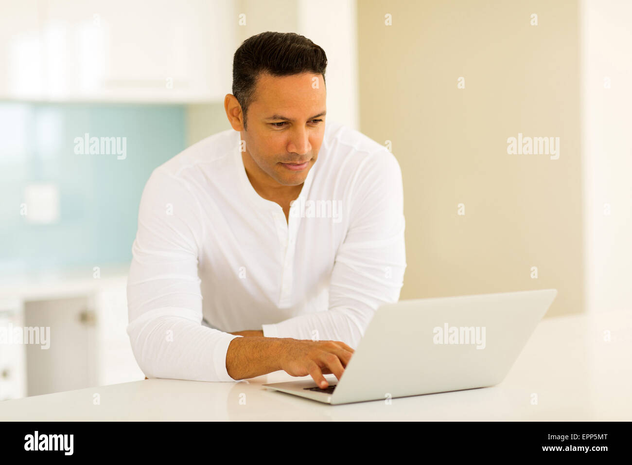 modern man reading emails on laptop computer Stock Photo