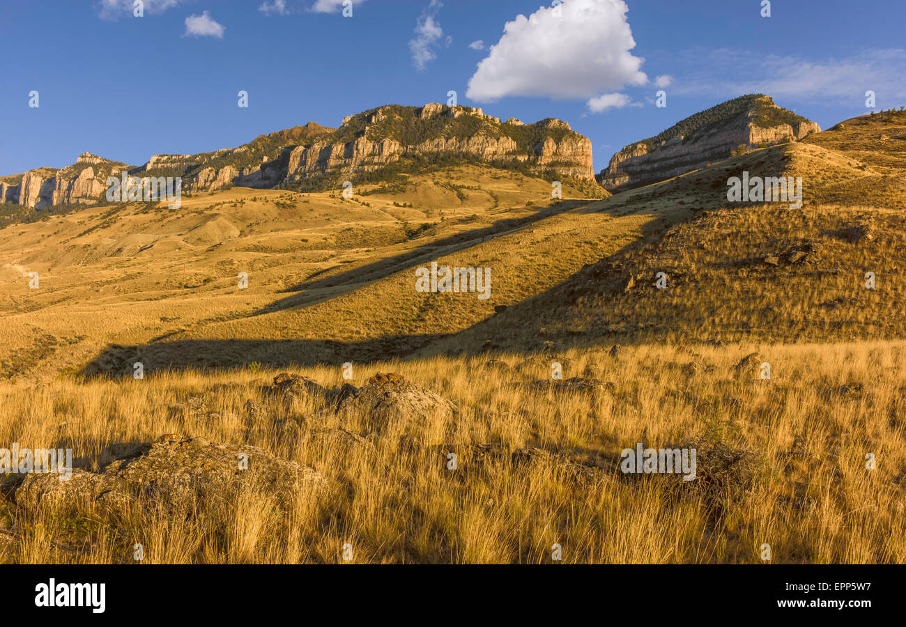 View across the rugged undulating landscape of Buffalo Bill State park showing the rocky mountains near Cody, Wyoming, USA. Stock Photo