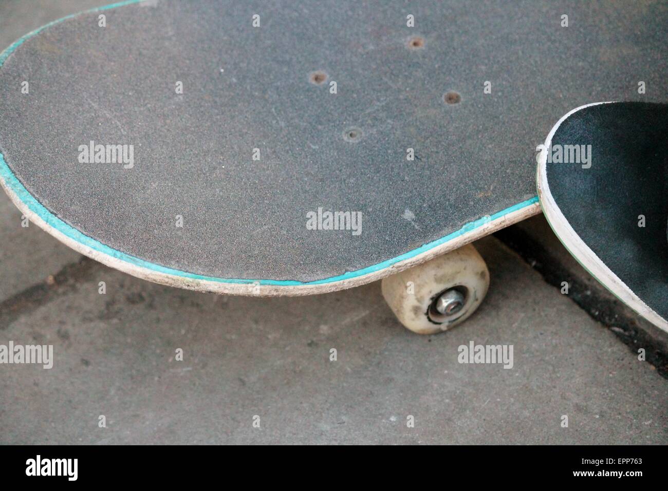 lone skateboard on concrete background with copy space Stock Photo - Alamy