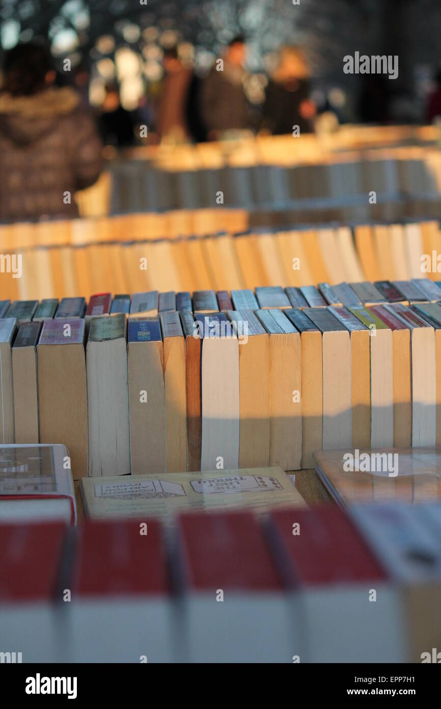 Market stall selling second hand books spine visible book, market