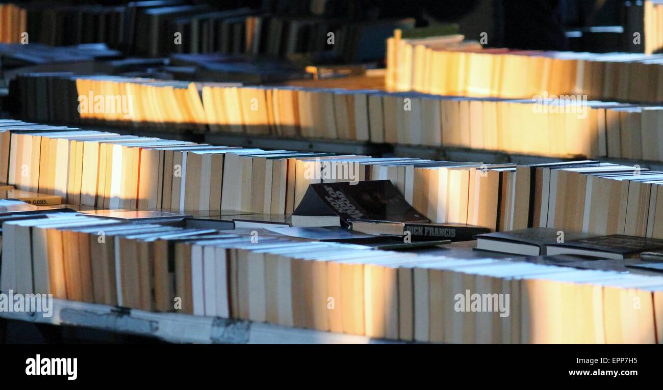 Market stall selling second hand books spine visible book, market