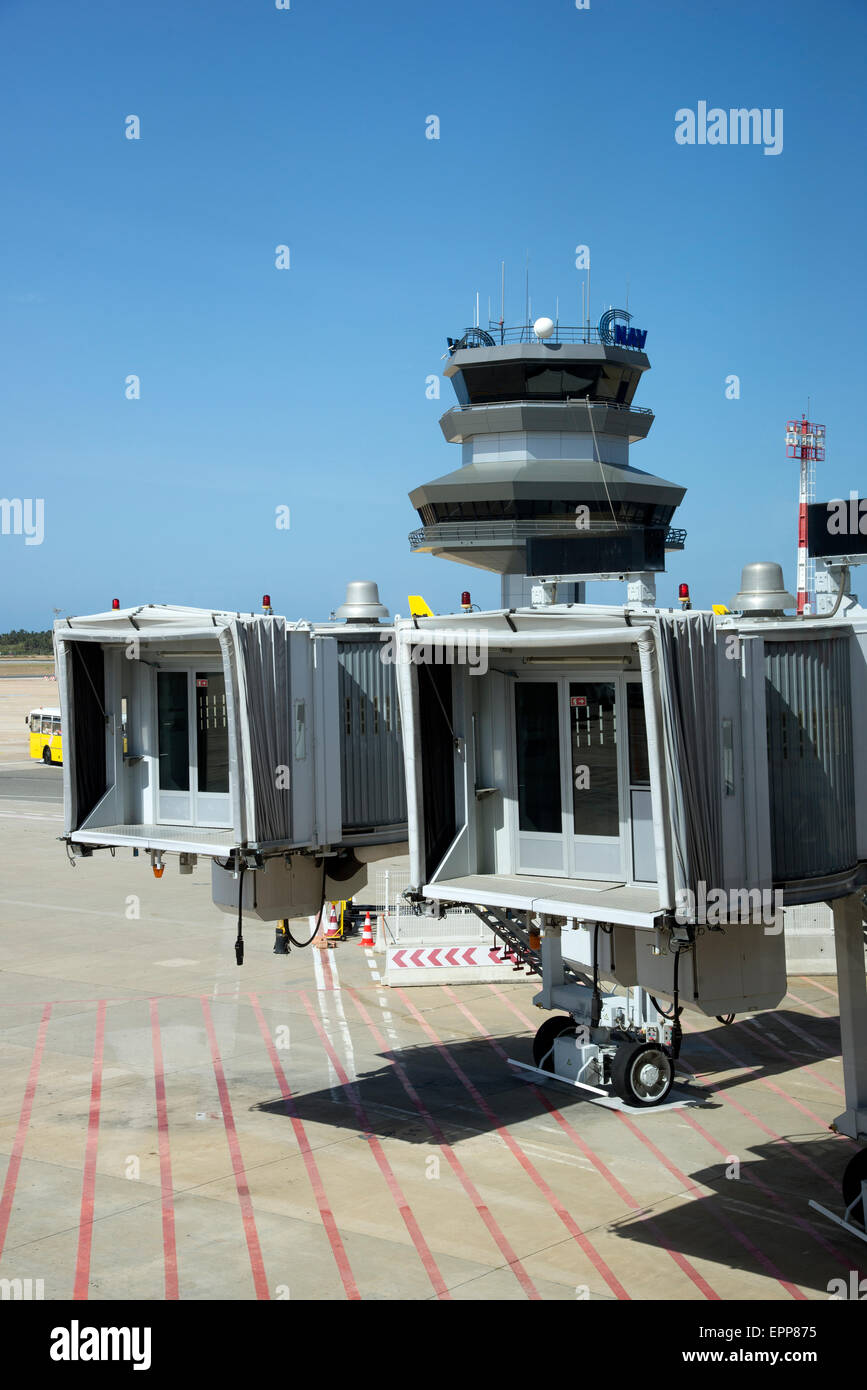 Airport control tower and passenger loading jetways on the apron at Lisbon  International Airport Portugal Stock Photo - Alamy