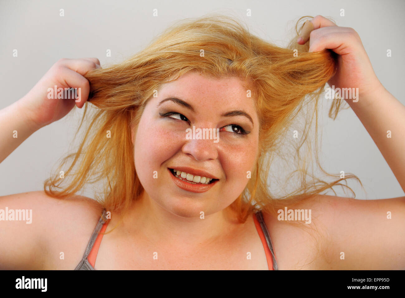 An overwhelmed girl pulls her hair Stock Photo Alamy