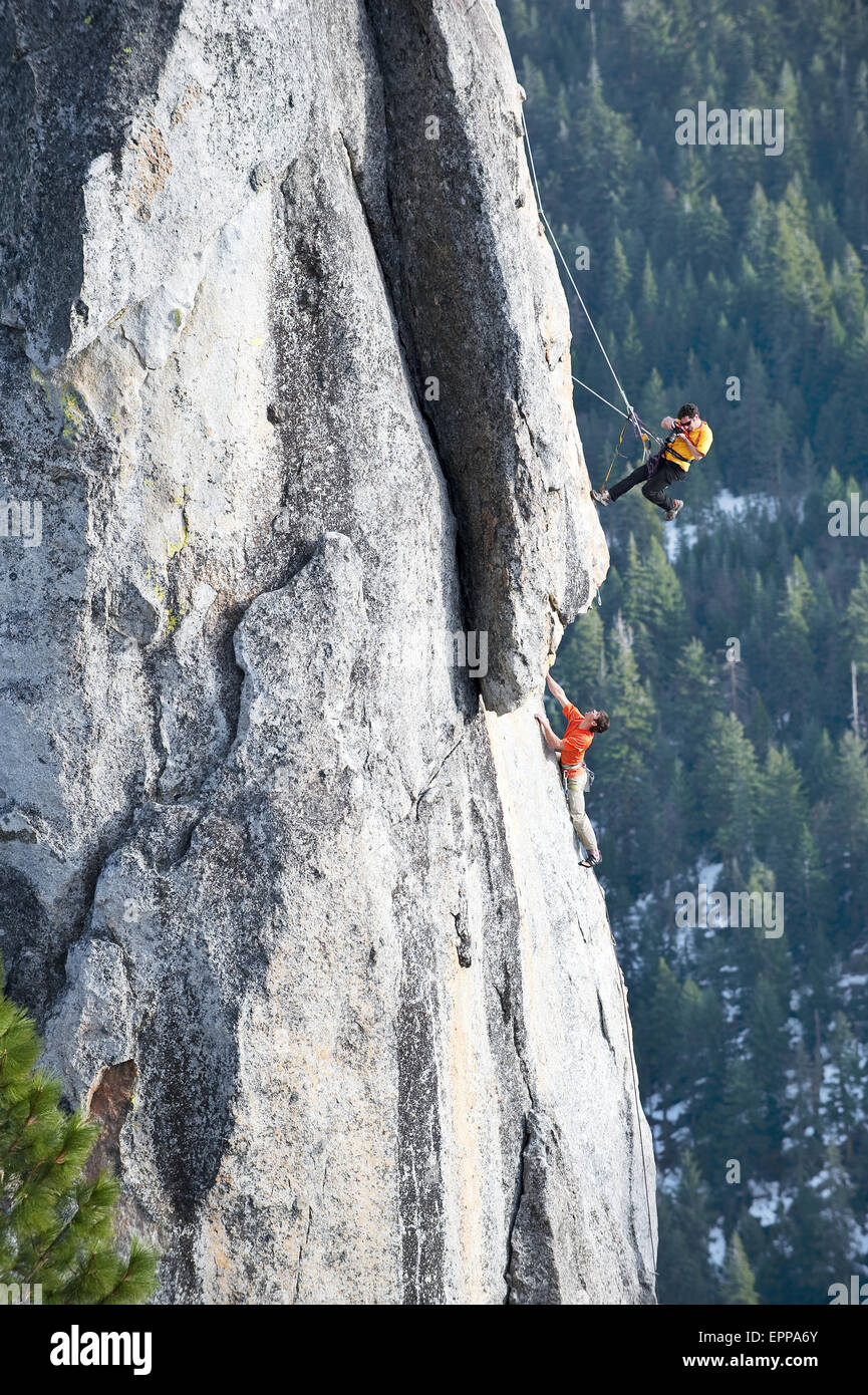 A photographer photographs a rock climber in Calif. Stock Photo