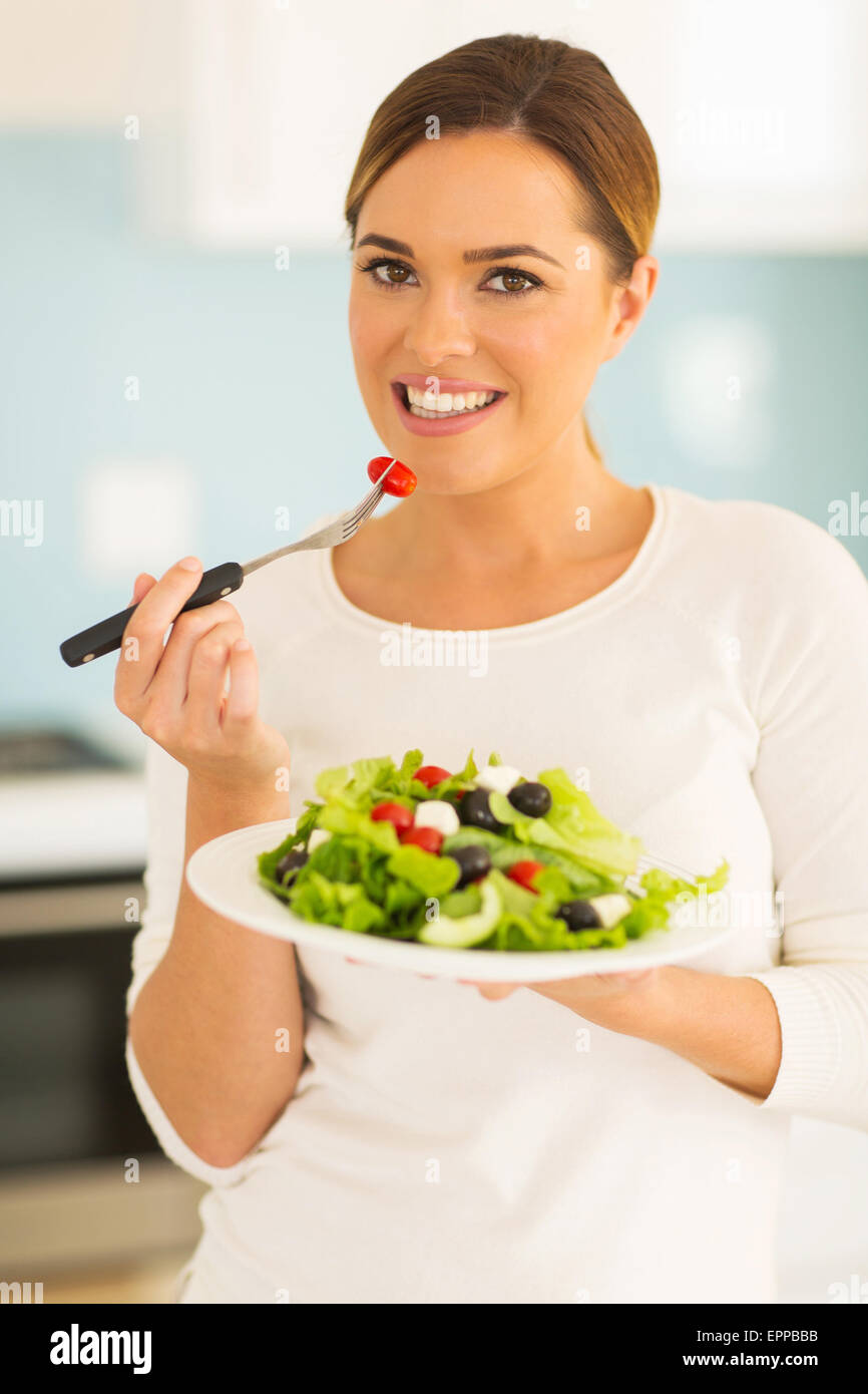 portrait of pretty woman eating salad Stock Photo