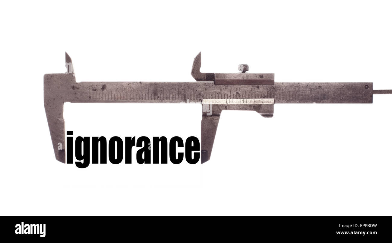 Color horizontal shot of a caliper and measuring the word "ignorance