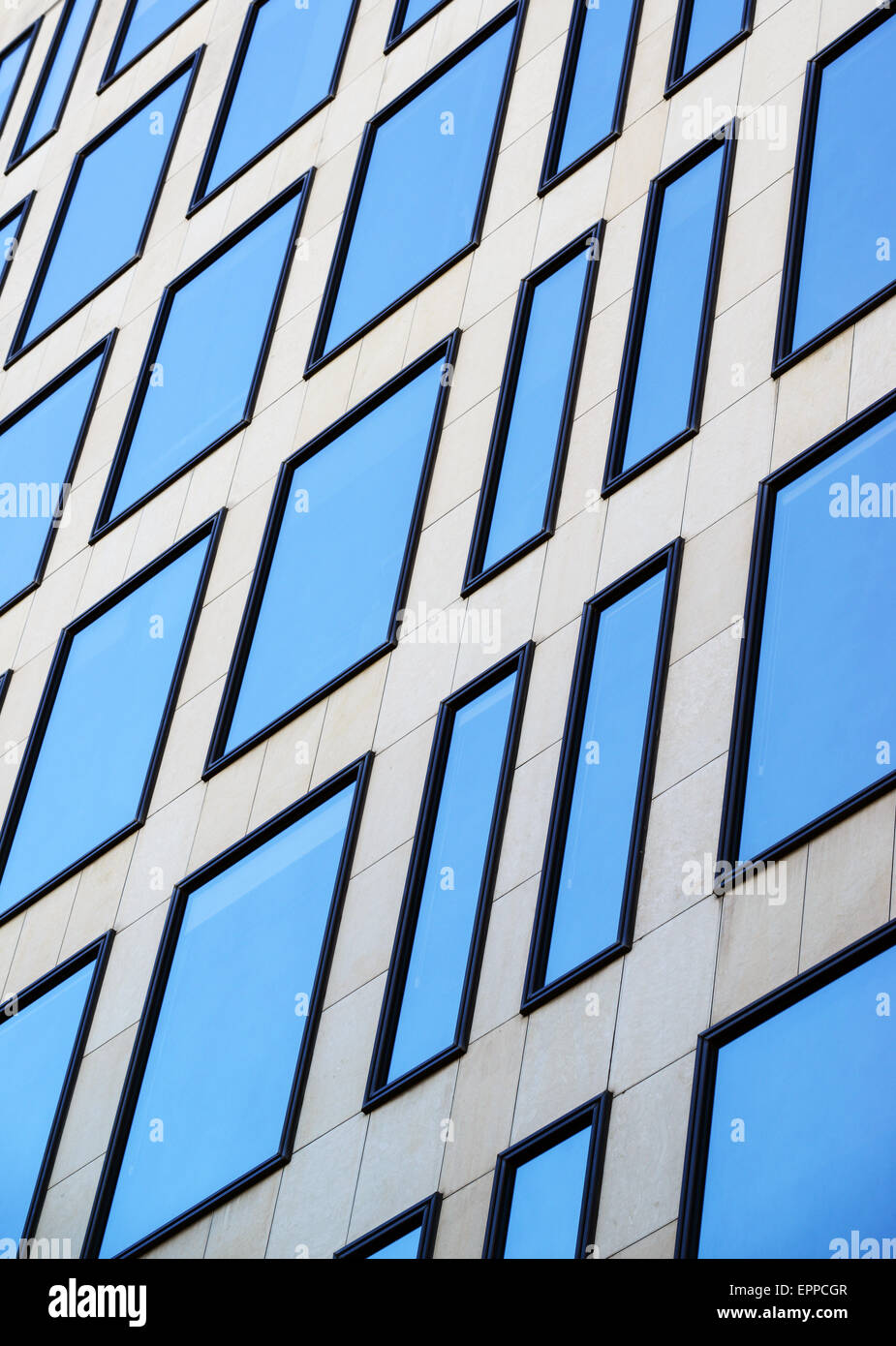 Modern office building windows with sky reflection Stock Photo - Alamy