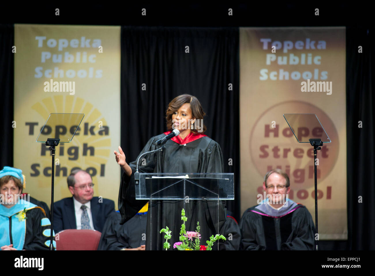 Mrs. Michelle Obama delvers her address to the graduating class of 2014 of all 4 local Topeka High Schools. Stock Photo