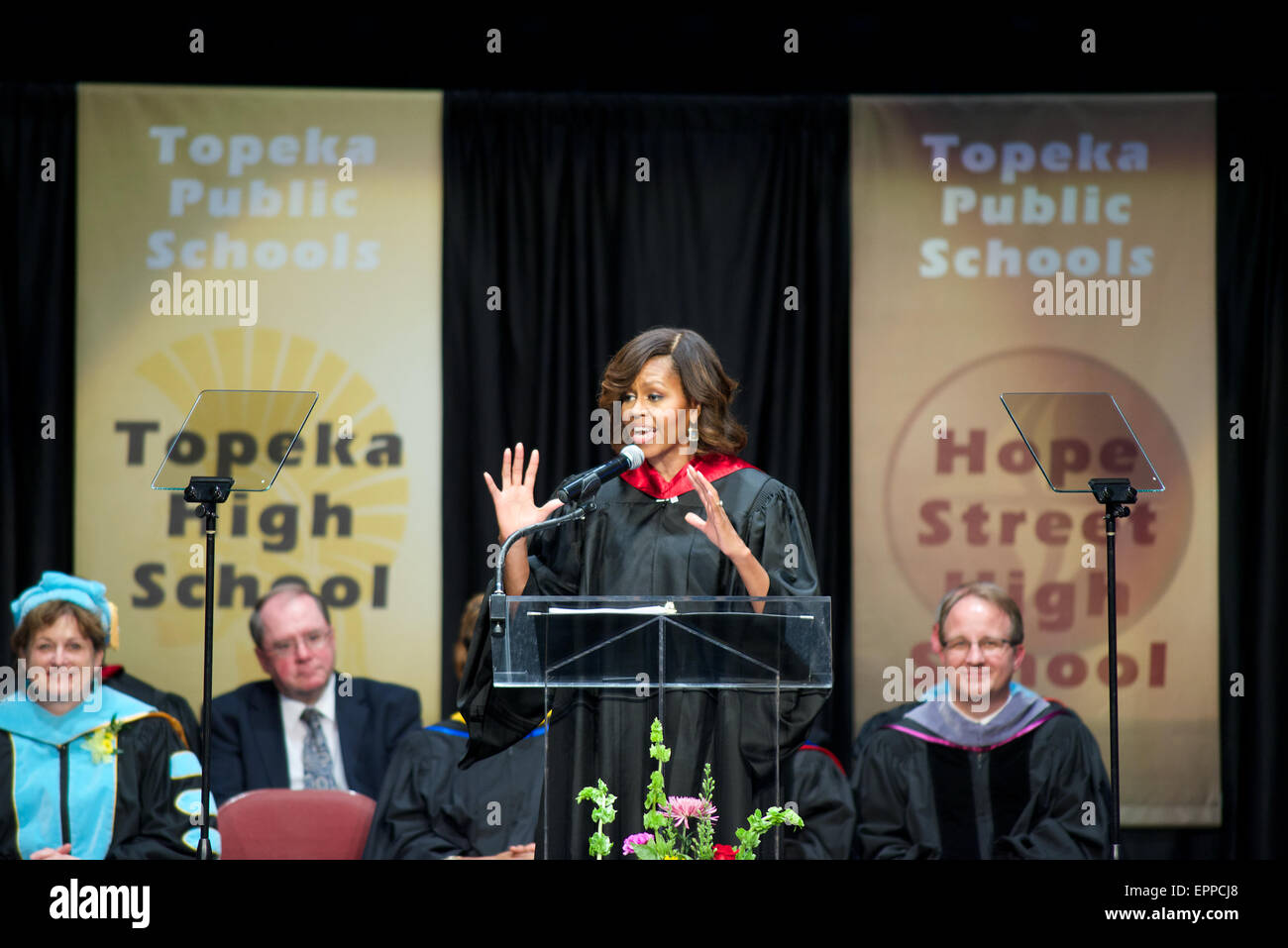 Mrs. Michelle Obama delvers her address to the graduating class of 2014 of all 4 local Topeka High Schools. Stock Photo