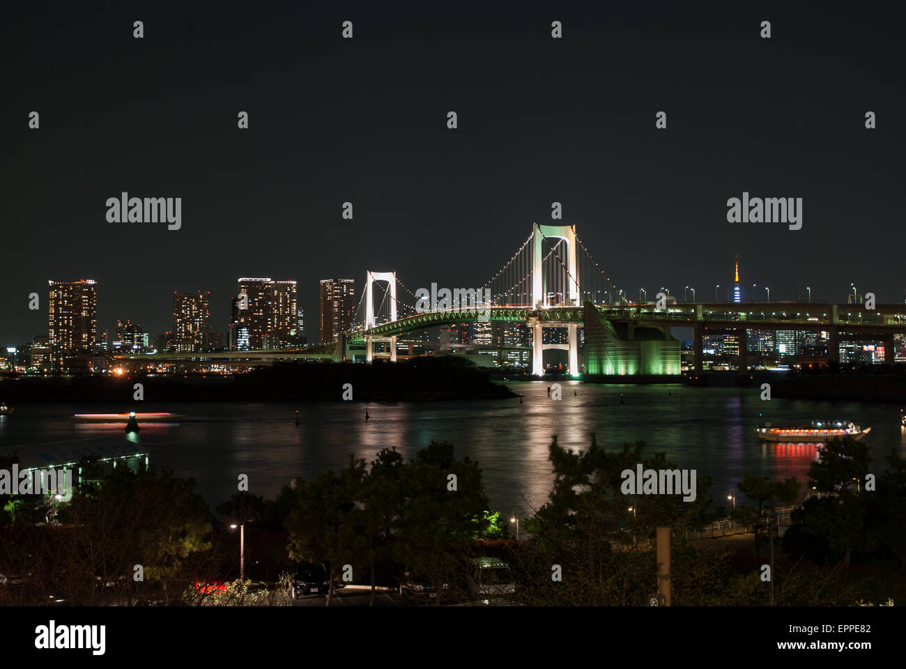 Rainbow bridge and the city of Tokyo Japan at Night. The many colorful lights of the city of Tokyo at night Stock Photo