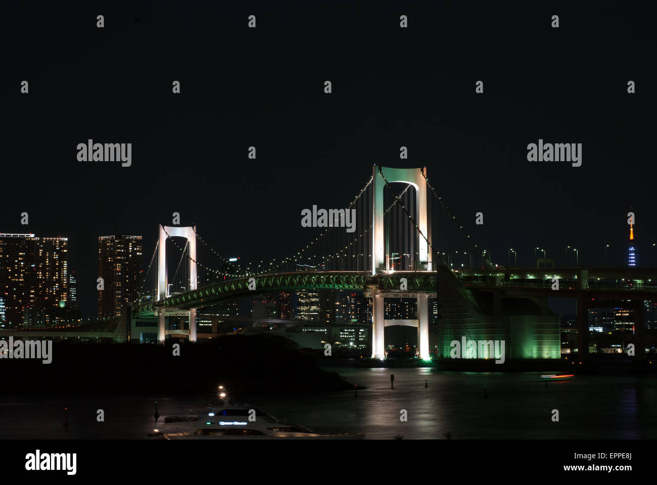 Rainbow bridge and the city of Tokyo Japan at Night. The many colorful lights of the city of Tokyo at night Stock Photo