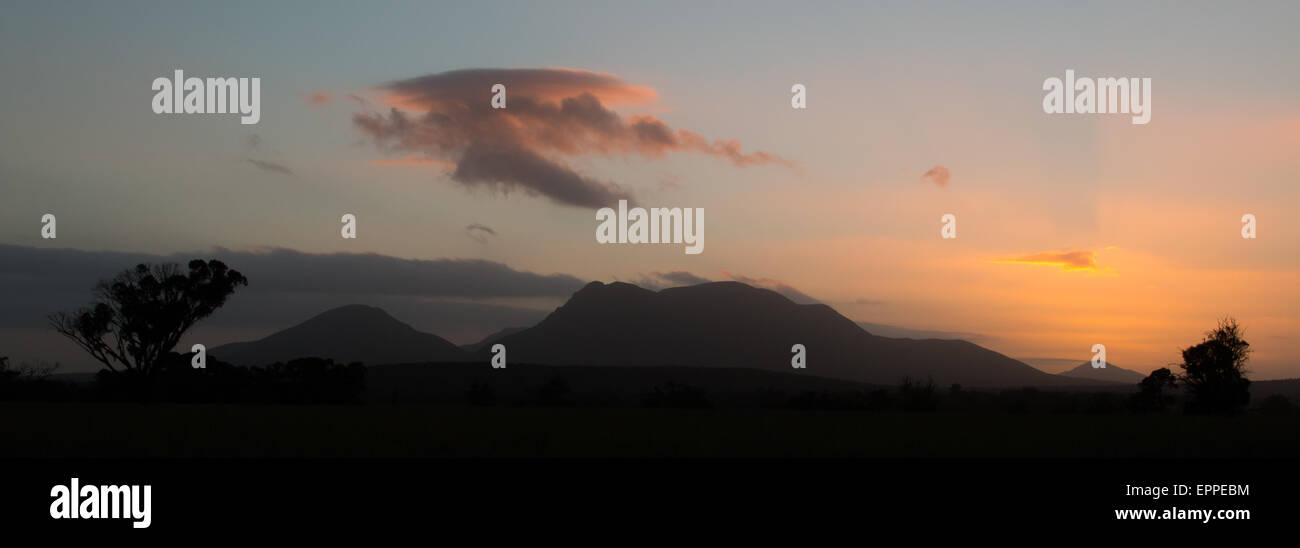 Stirling Range (Western Australia) at sunset with a dragon-shaped cloud in the sky Stock Photo