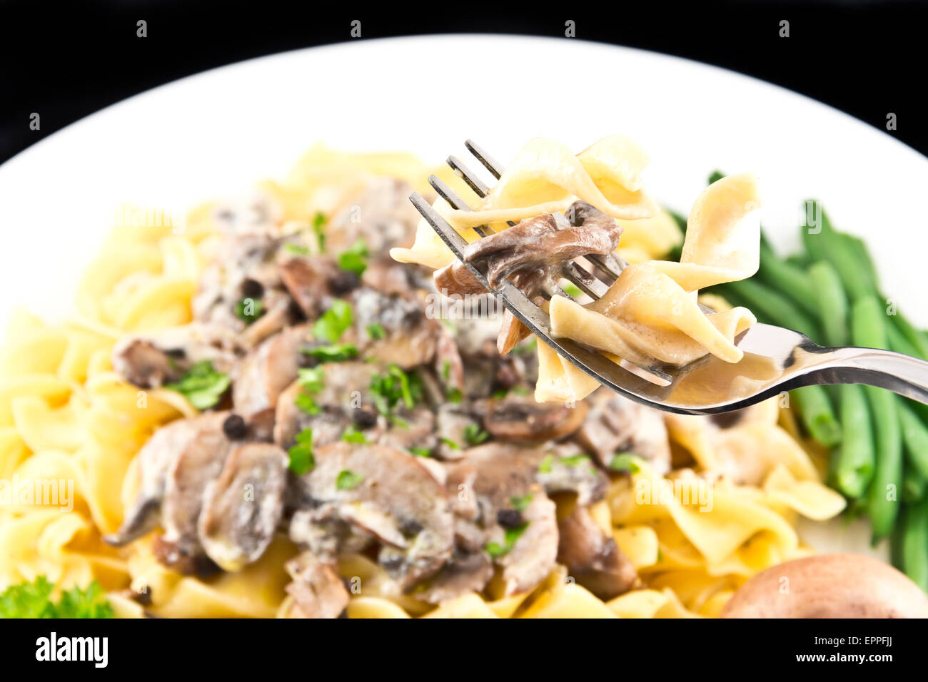 Vegetarian mushroom stroganoff with egg noodles Stock Photo - Alamy