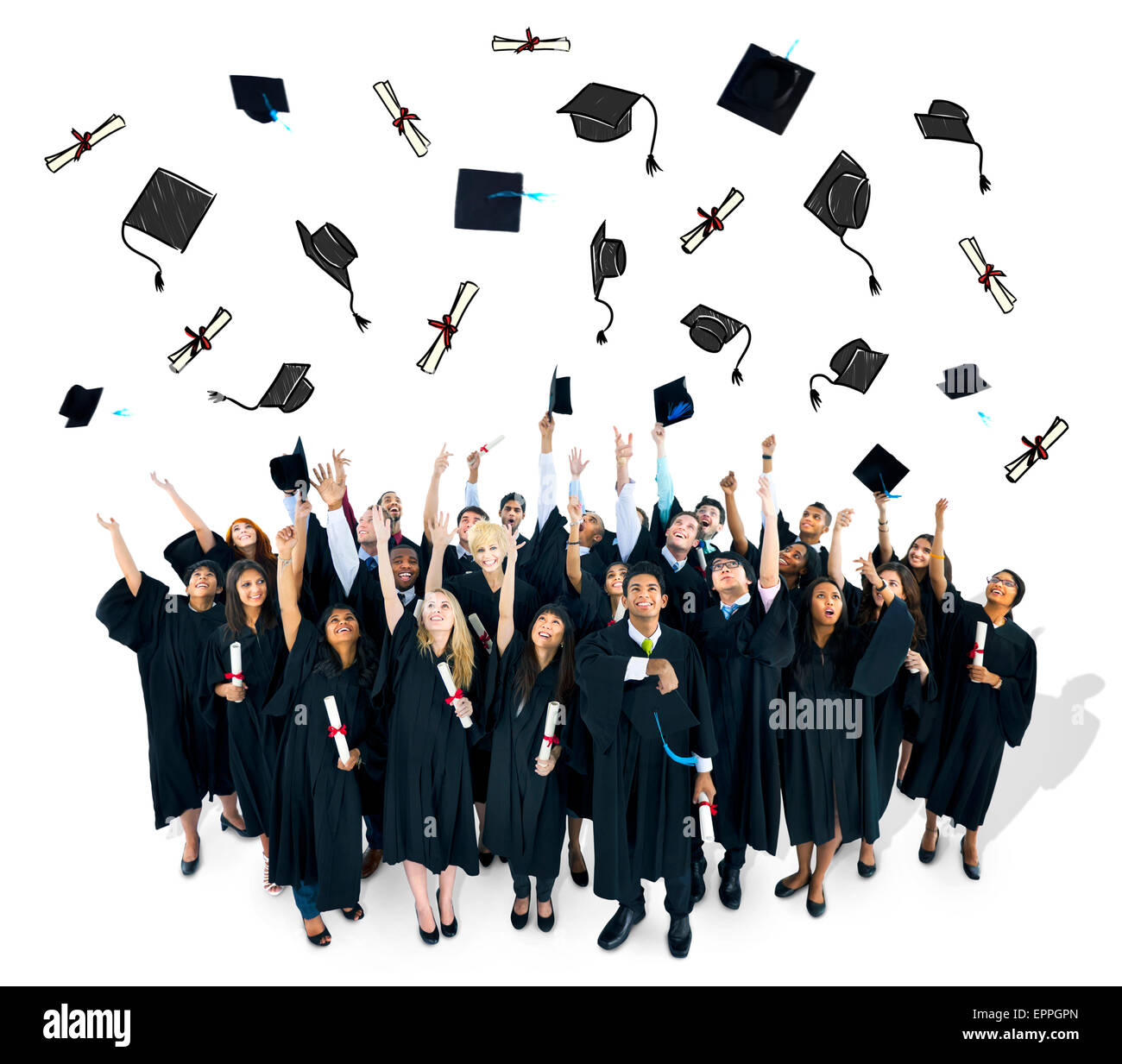 Graduates throwing their graducation caps. Stock Photo