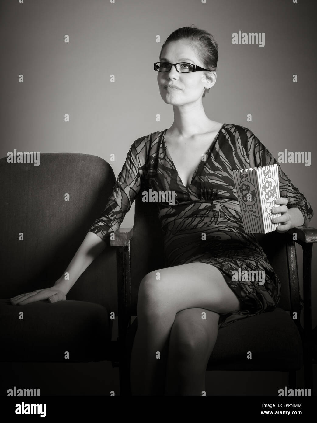 Young woman with a finger on lips Stock Photo - Alamy