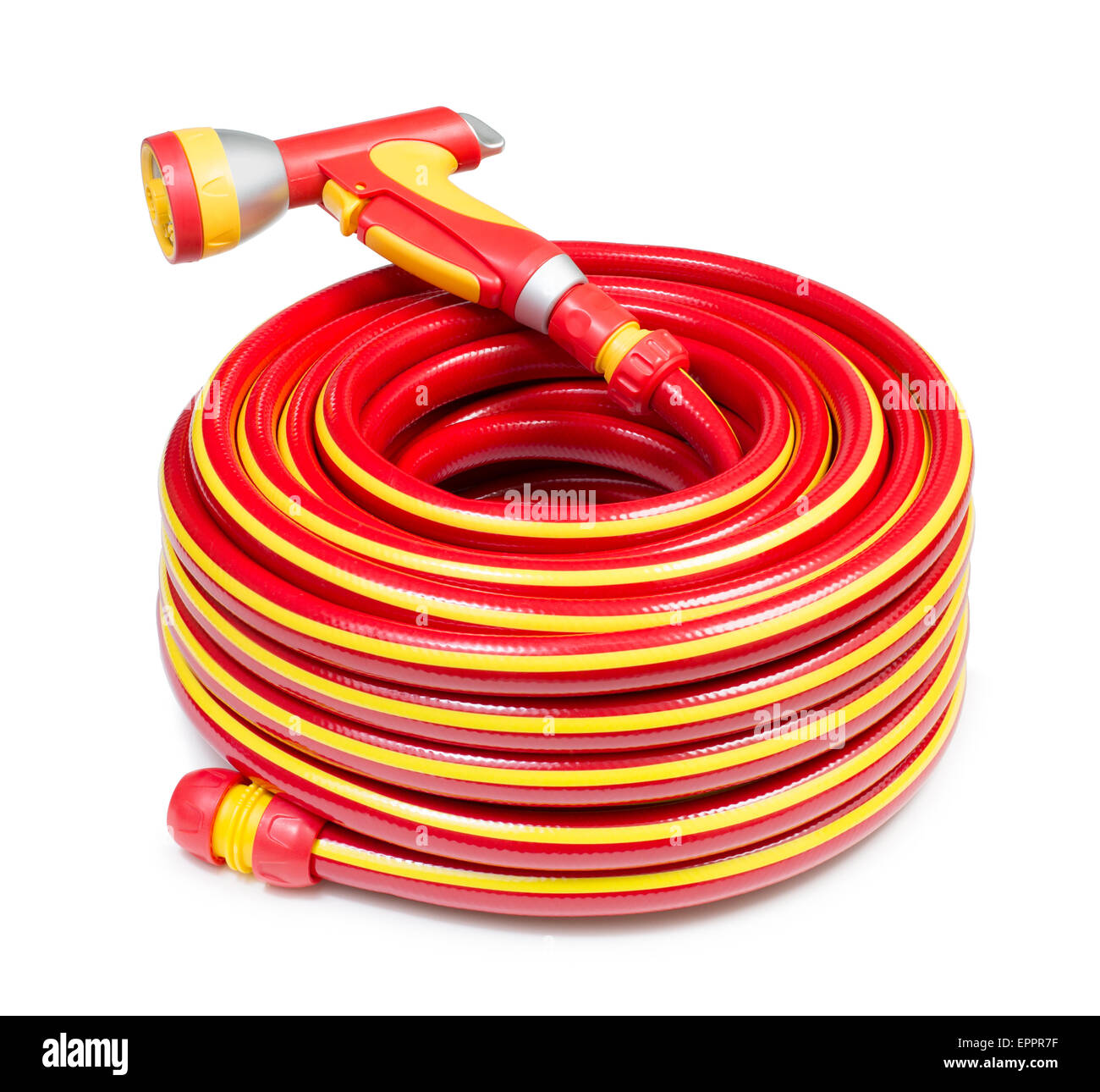 Red garden coiled hose with handle isolated Stock Photo