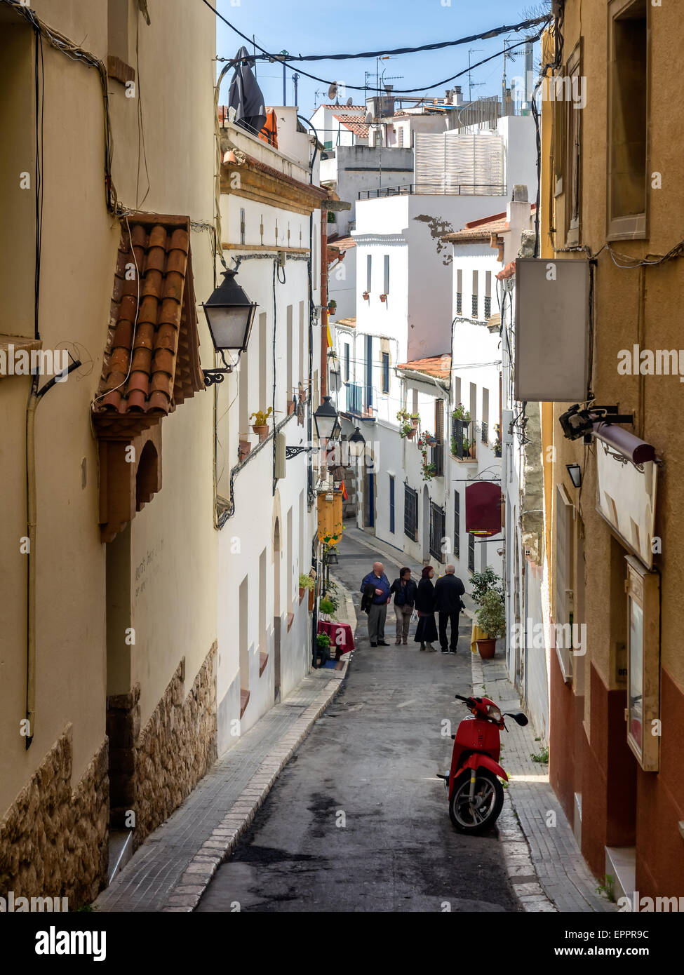 Narrow medieval street in Old Sitges, historical resort-city close to Barcelona in Spain Stock Photo