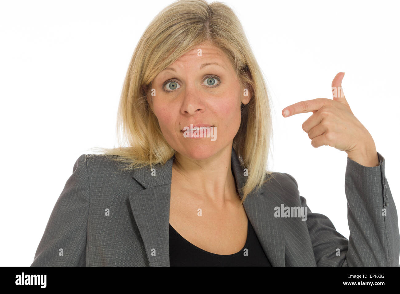 Subtle Pointing Model isolated on plain background in studio pointing Stock Photo - Alamy