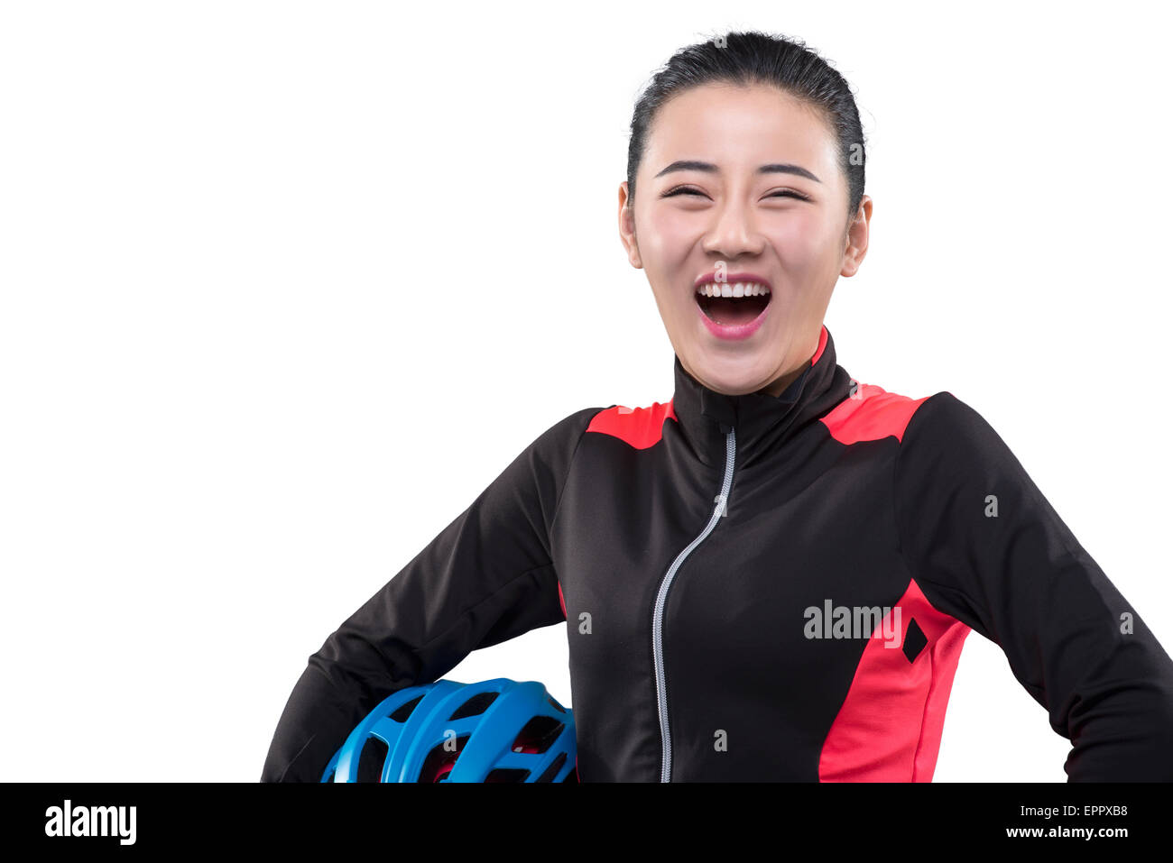 Young female cyclist holding cycling helmet Stock Photo