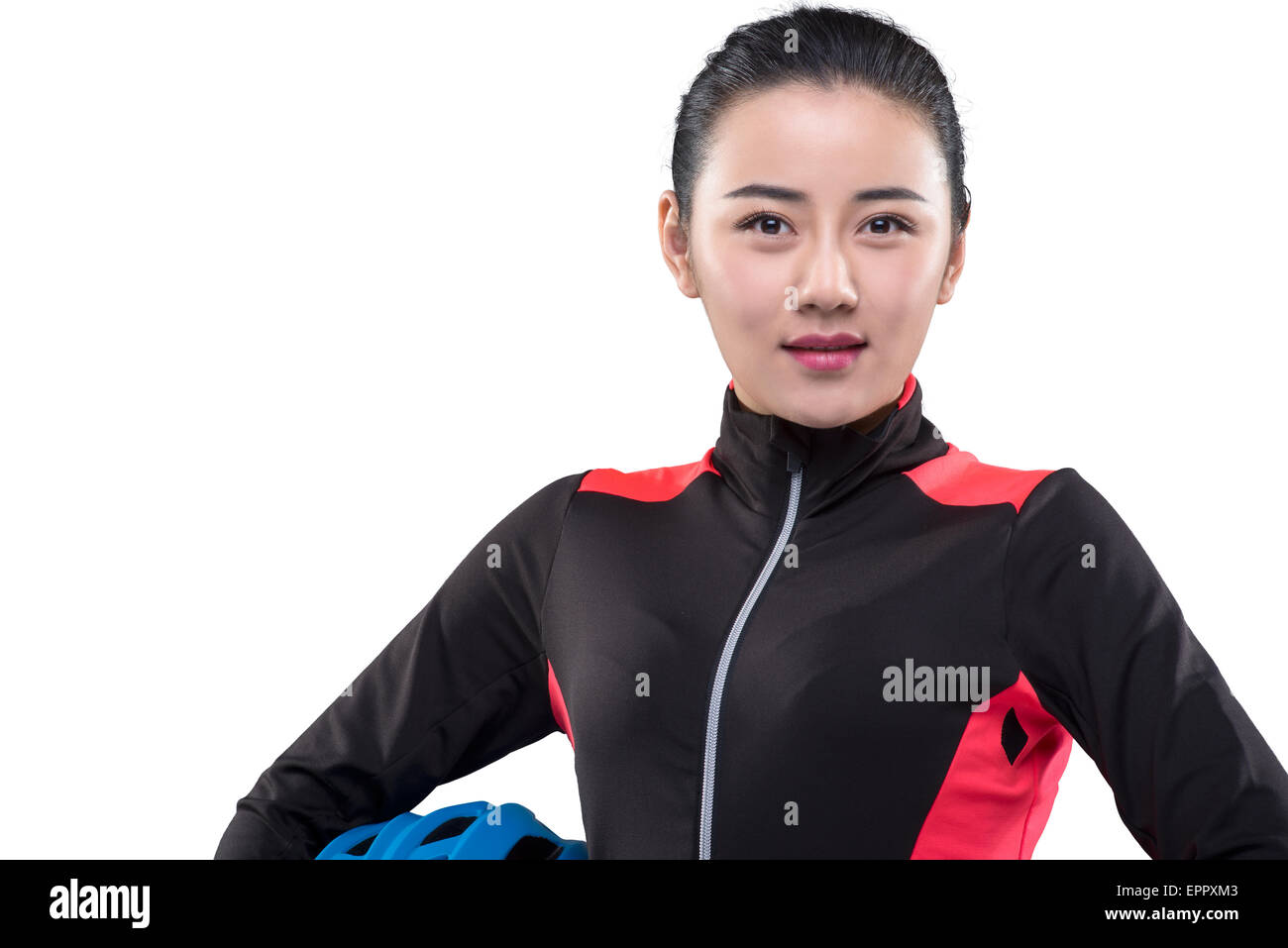 Young female cyclist holding cycling helmet Stock Photo