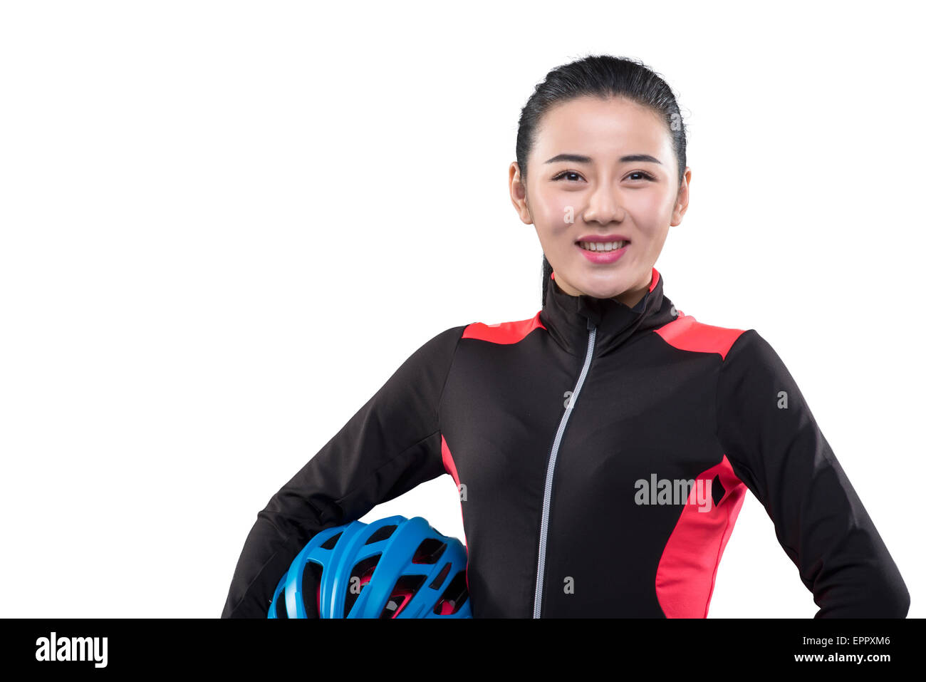 Young female cyclist holding cycling helmet Stock Photo