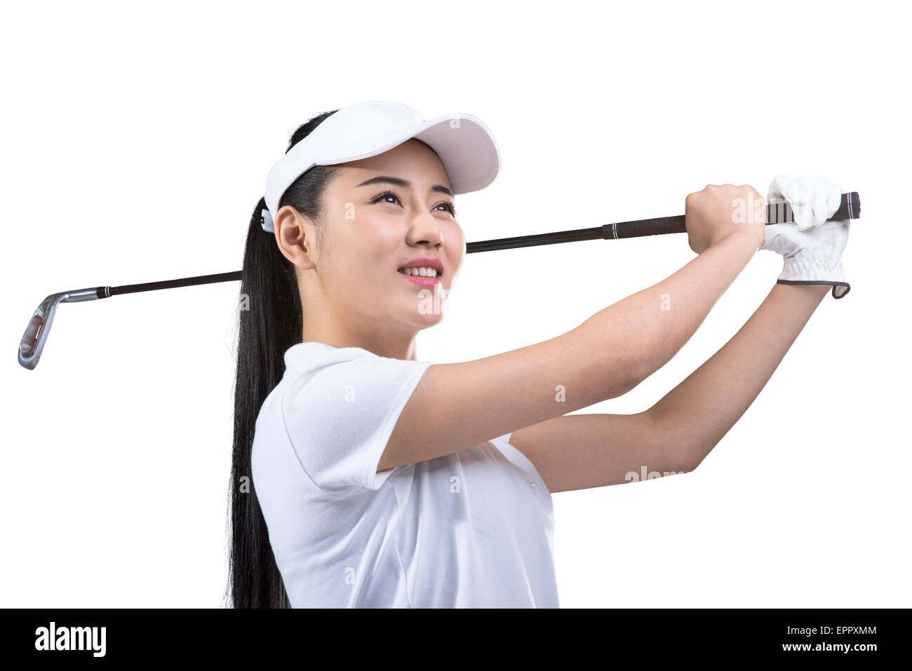 Young female golfer swinging golf club Stock Photo Alamy