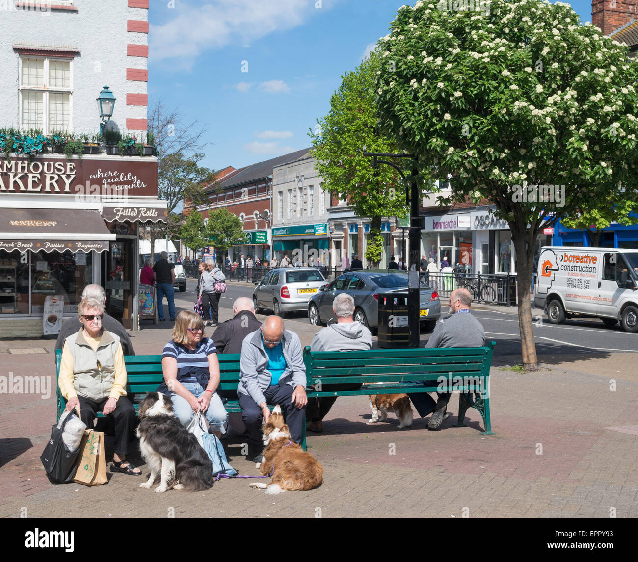 Older  people sitting Skegness town centre, Lincolnshire, England, UK Stock Photo