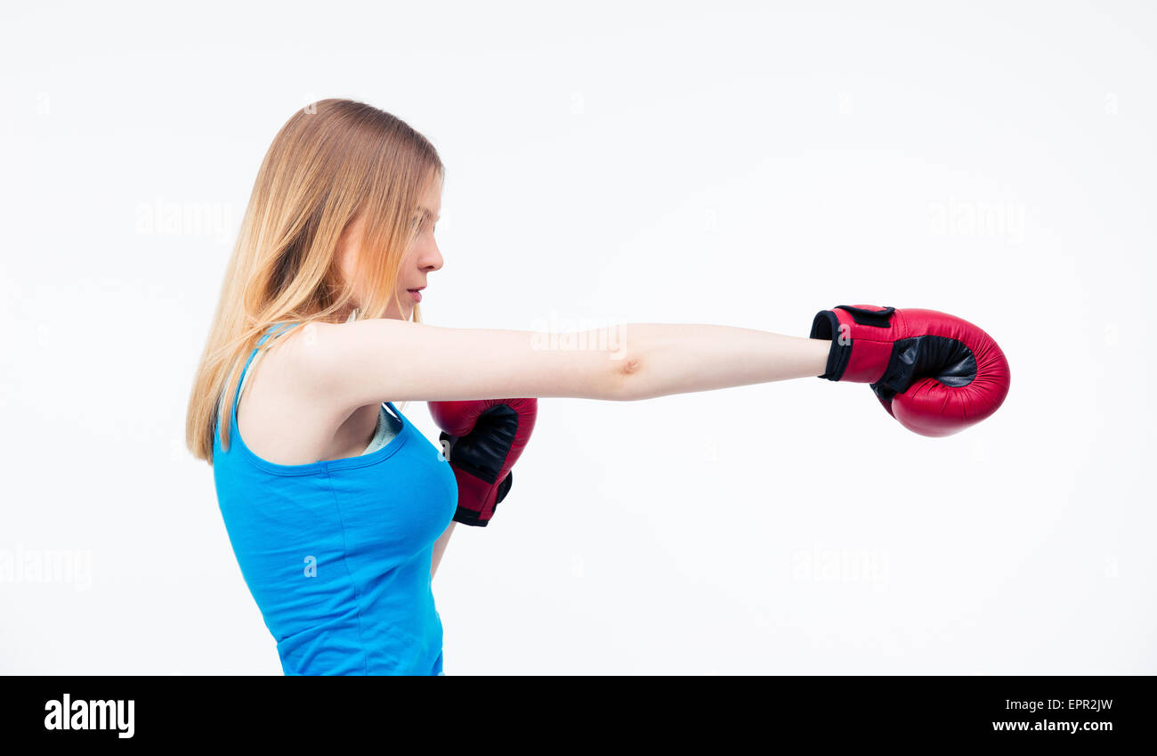 girl in gray sweatpants and top stands in a Boxing pose on a white  background. The concept of a strong woman Stock Photo - Alamy