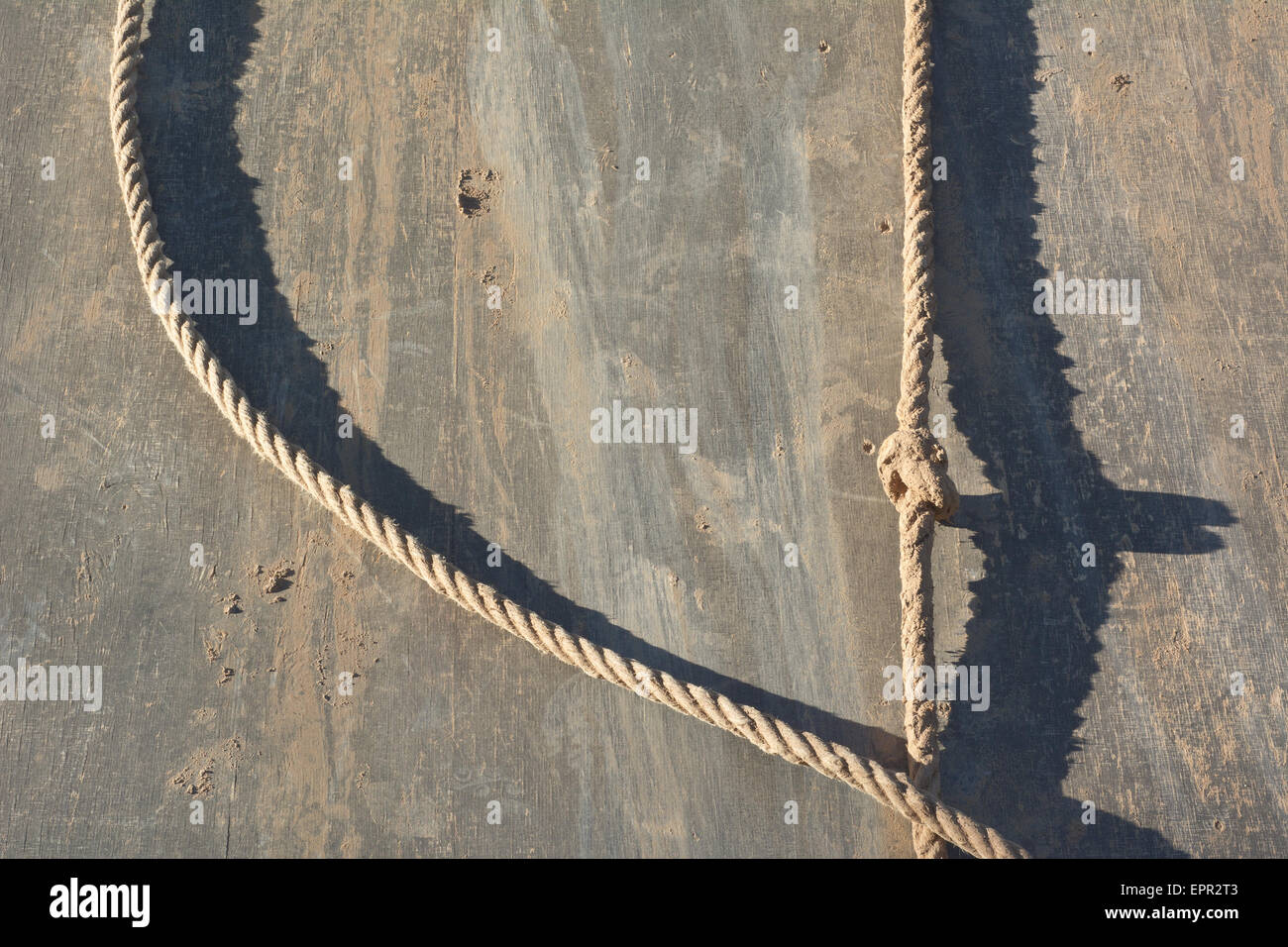 Muddy Rappelling Wall with Rope as Healthy Exercise Stock Photo