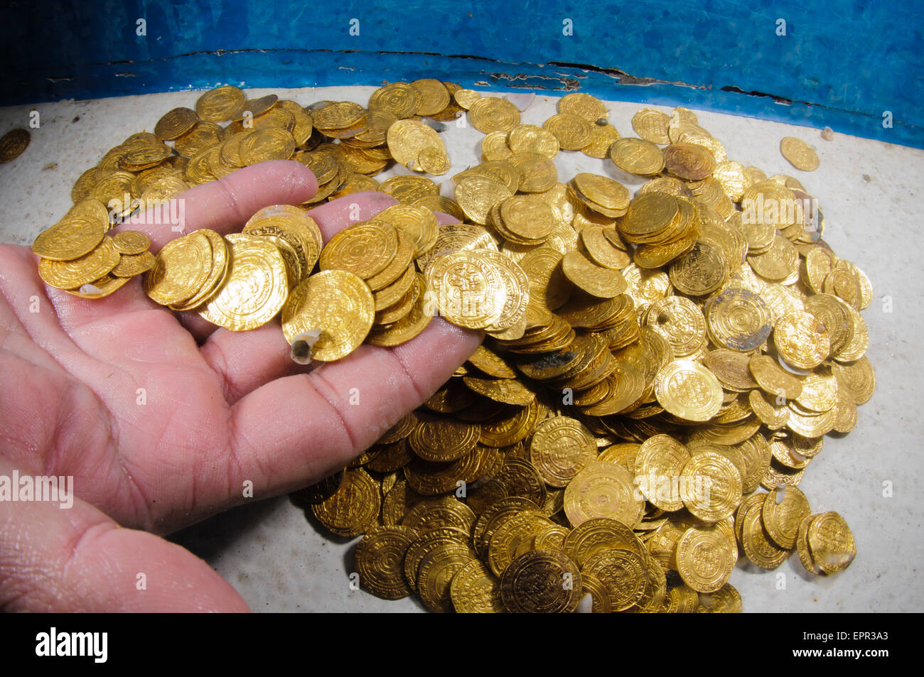 Scuba Divers uncover a hoard of 2000 gold coins from the Fatimid period (eleventh century CE) in the ancient harbour of Caesarea Stock Photo
