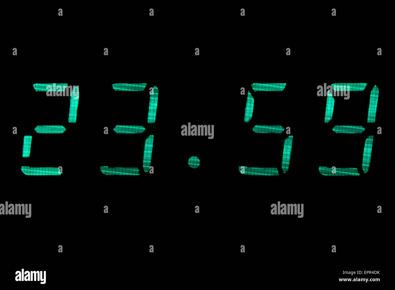 Digital clock in green Stock Photo