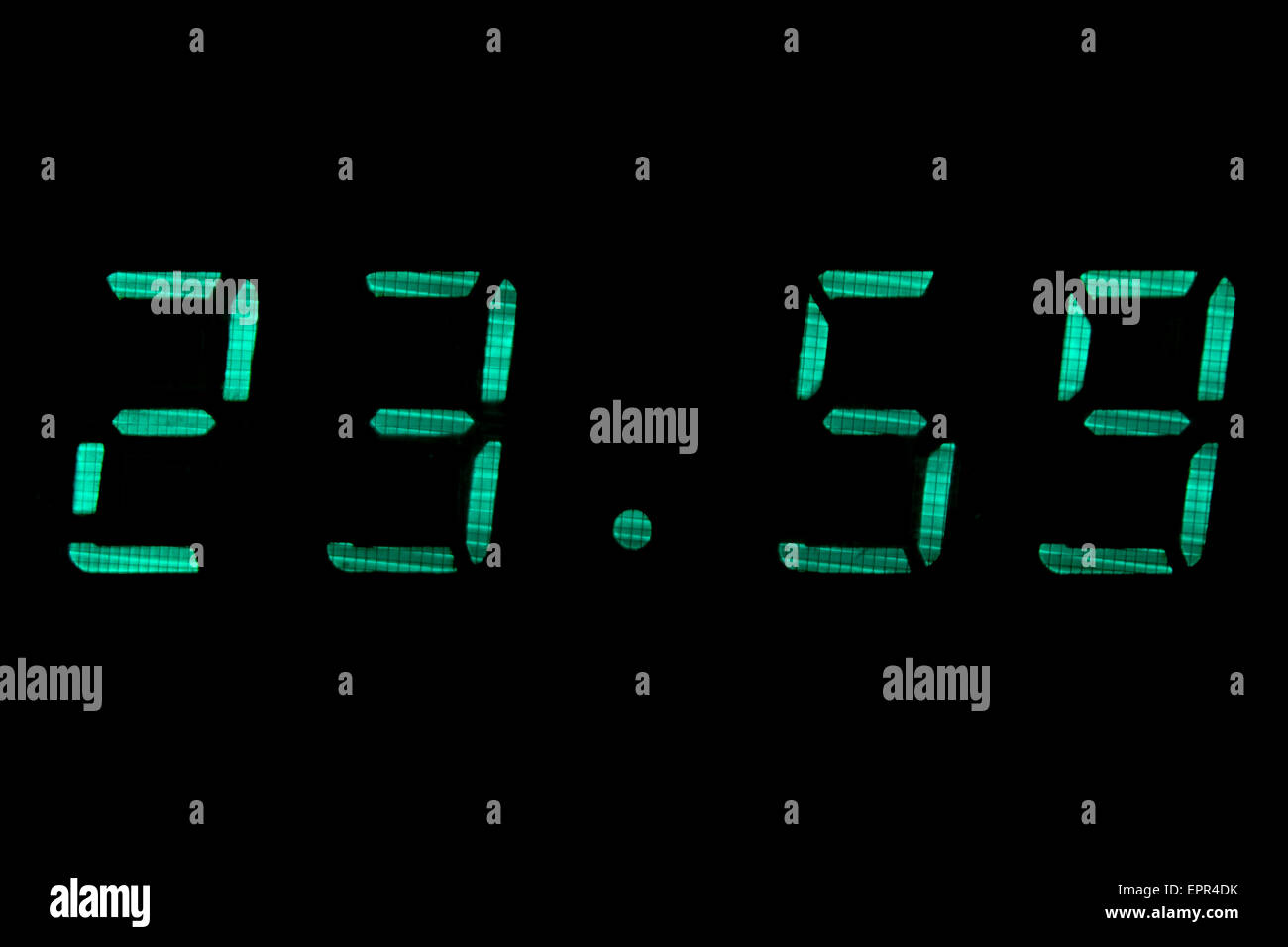 Digital clock in green Stock Photo Alamy