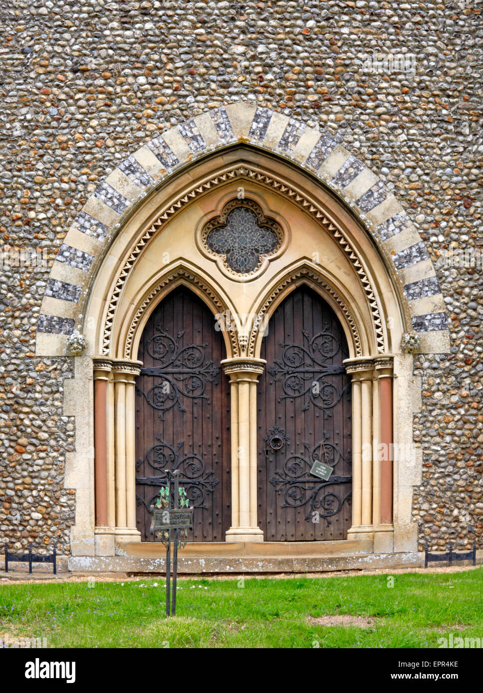 The south porch entrance in the tower of the parish church of St Withburga at Holkham, Norfolk, England, United Kingdom. Stock Photo