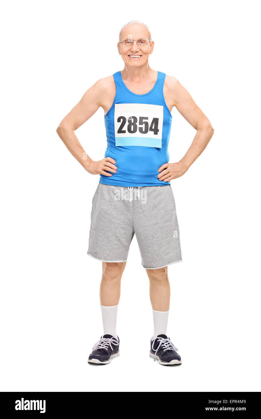 Full length portrait of a senior man in sportswear smiling and looking at the camera isolated on white background Stock Photo