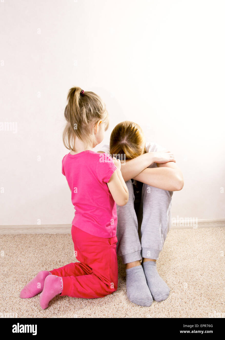 Violence in a family. The child and mother. Stock Photo