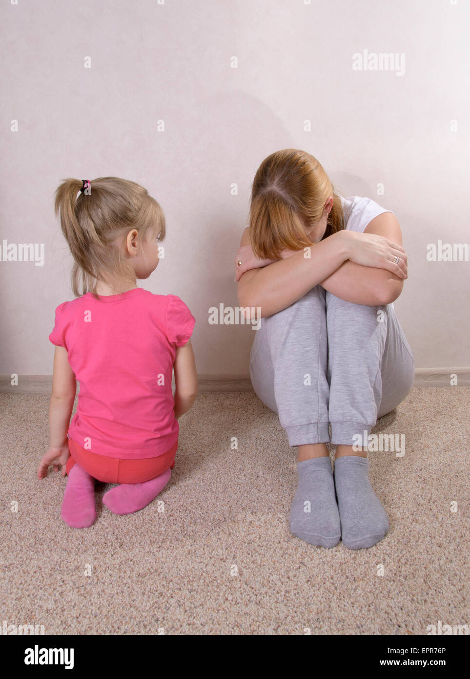 Violence in a family. The child and mother. Stock Photo