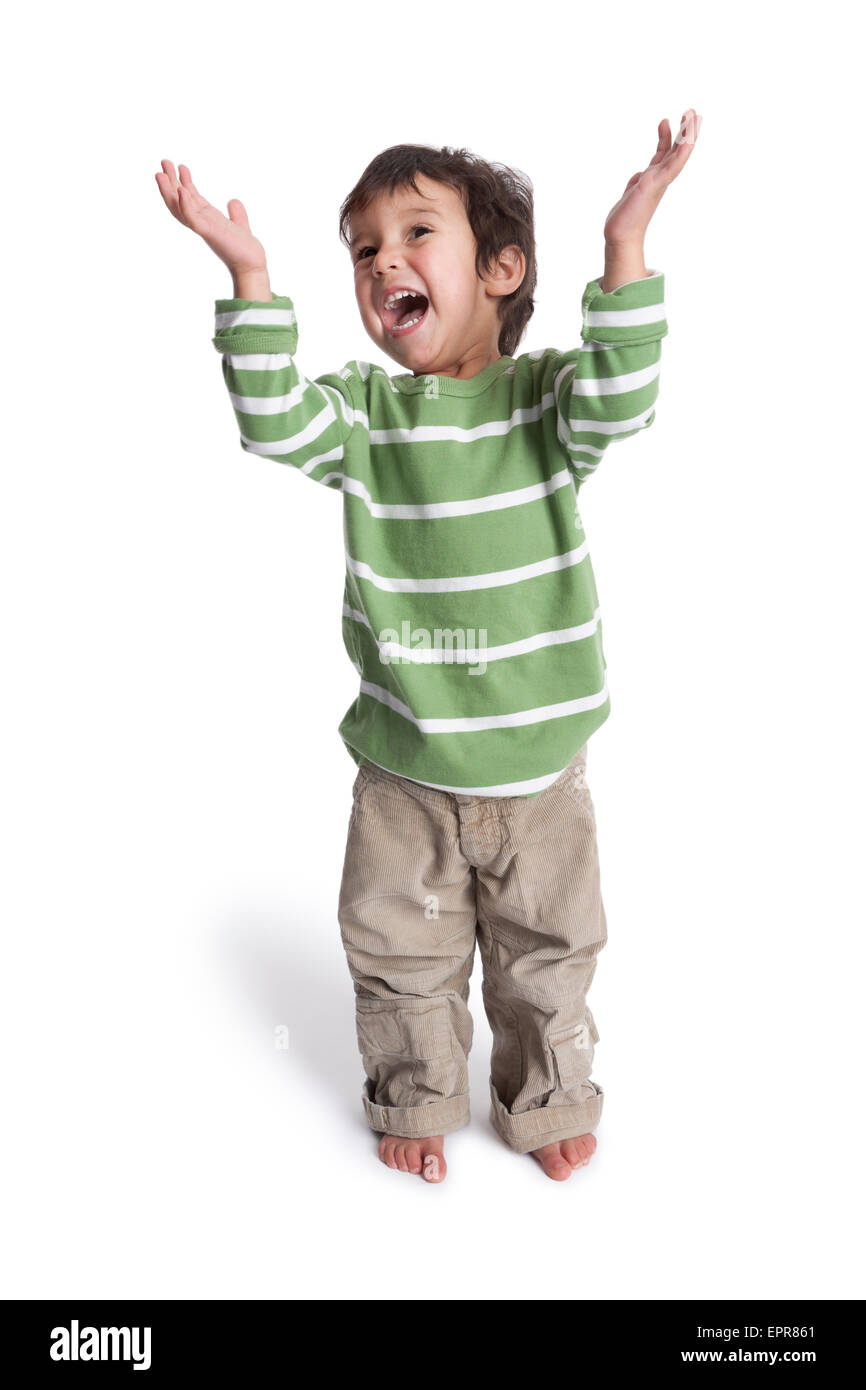 Happy singing two year old boy with his hands up Stock Photo
