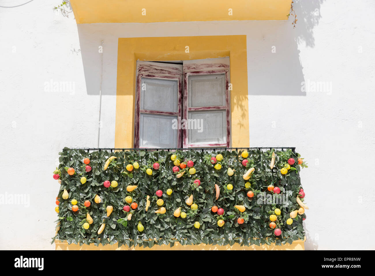 balcony decorated with plastic fruit and leaves in Ibiza Stock Photo