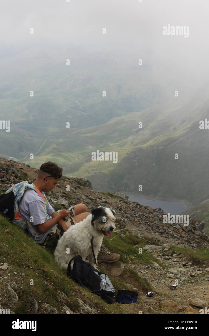 Climber and his dog on top of Snowden Stock Photo