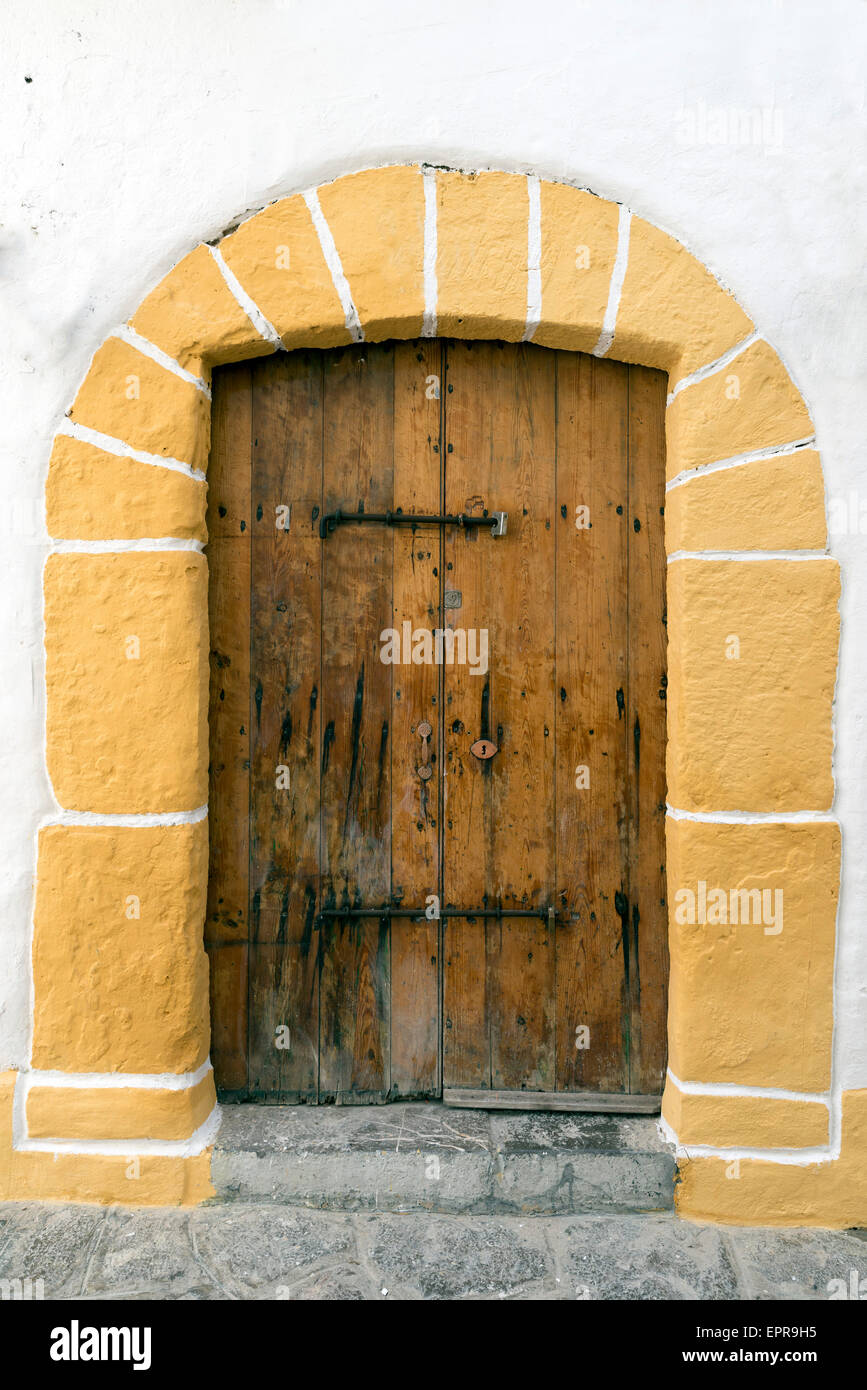 old door on a whitewashed wall. Ibiza Stock Photo