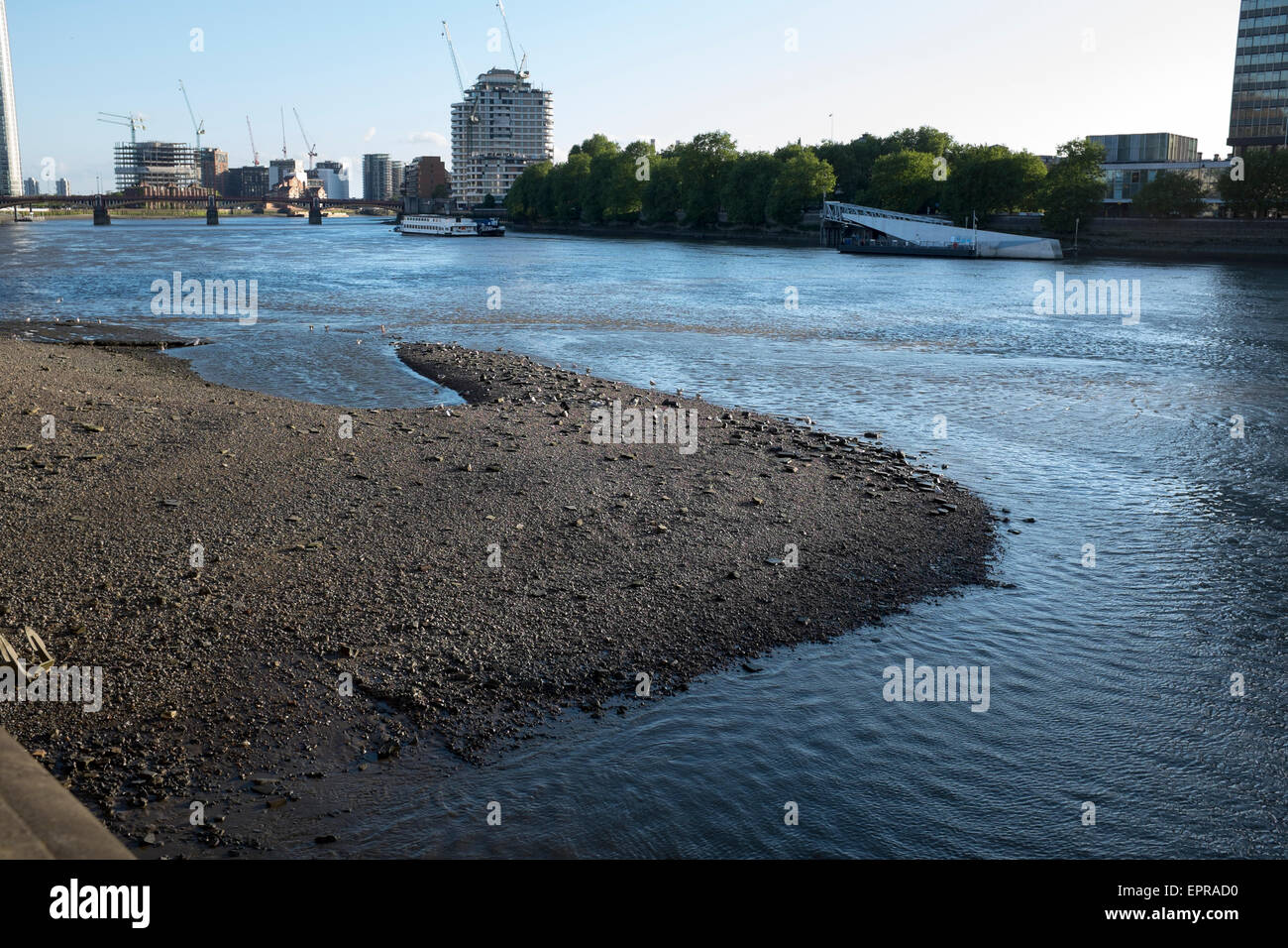 View along south side of River Thames towards Vauxhall with spit of sand at low tide Stock Photo