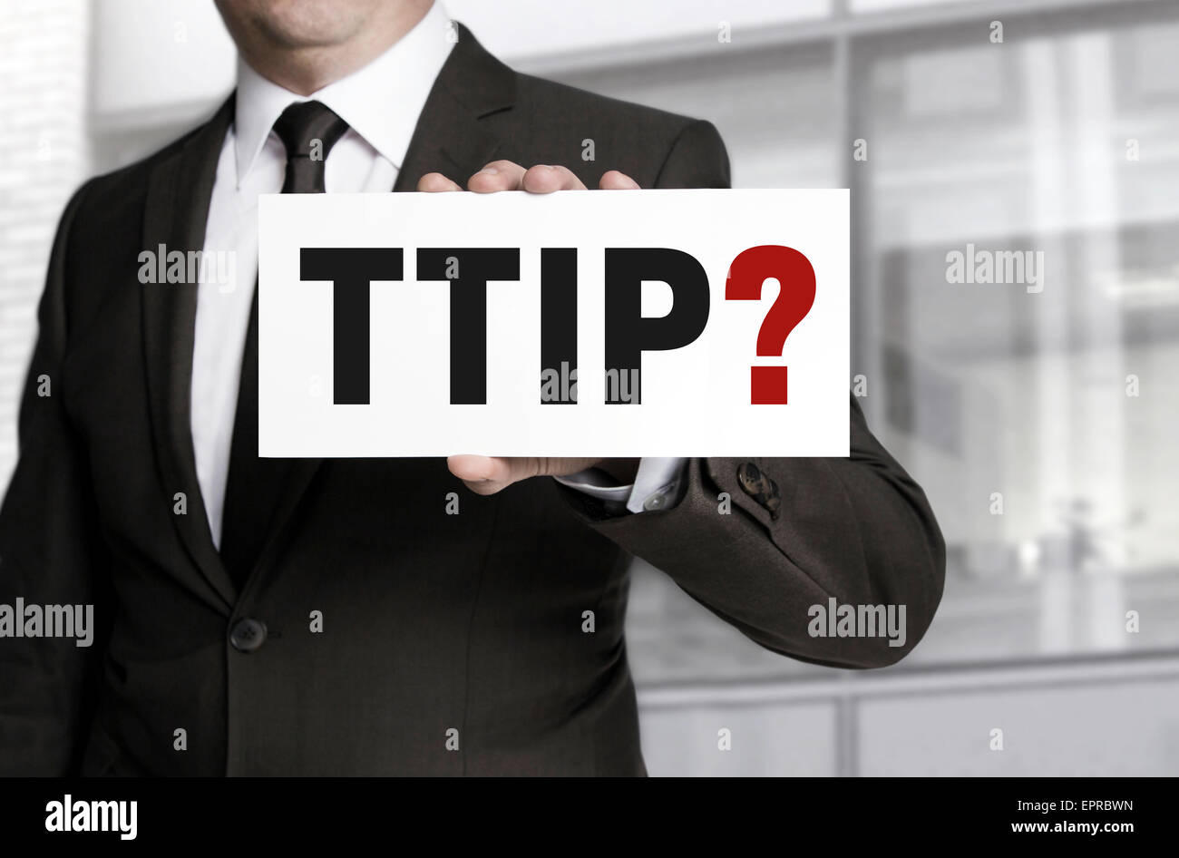 TTIP sign is held by businessman. Stock Photo